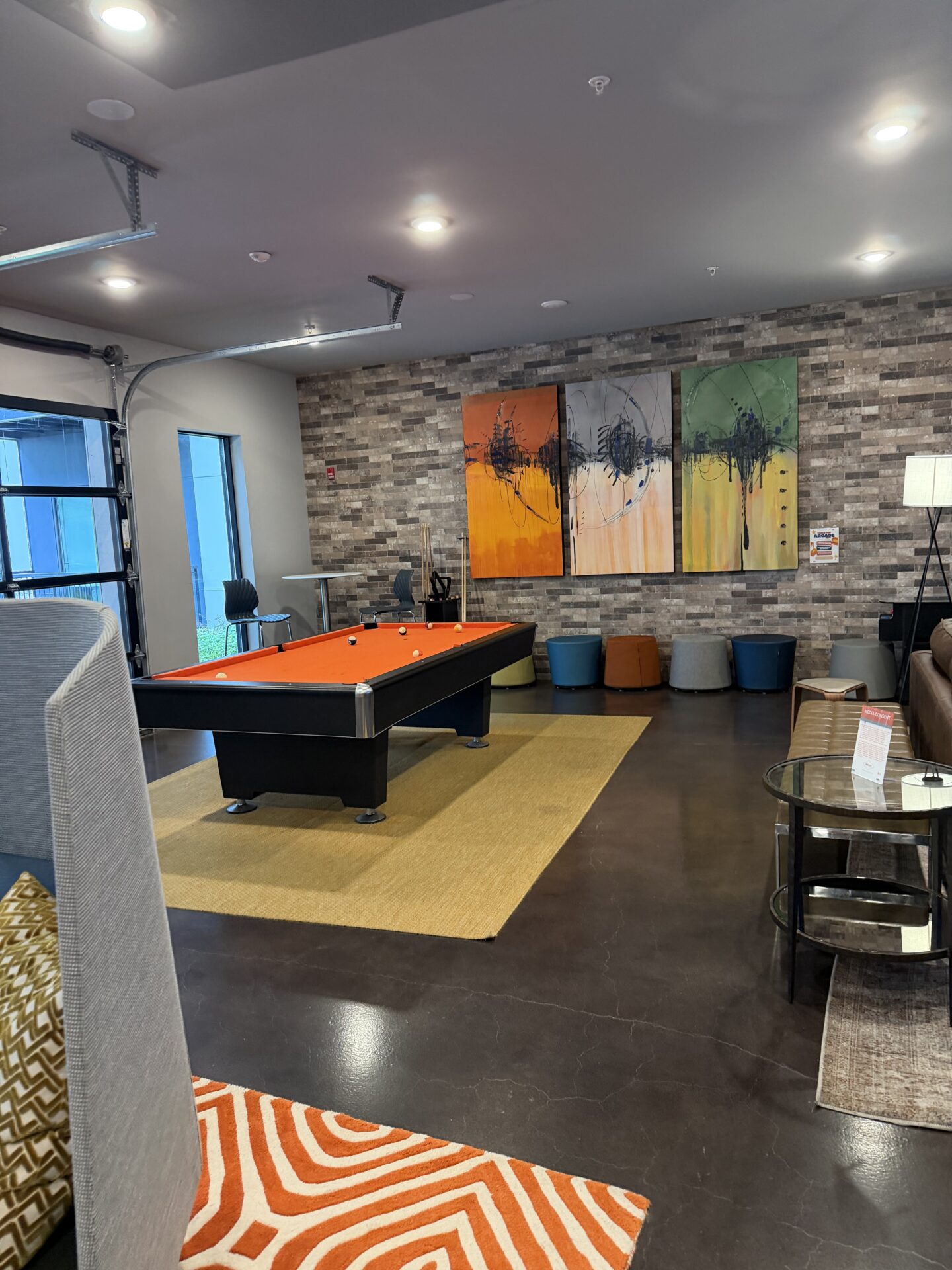 The Club Room at CURED with pool table and lounge seating